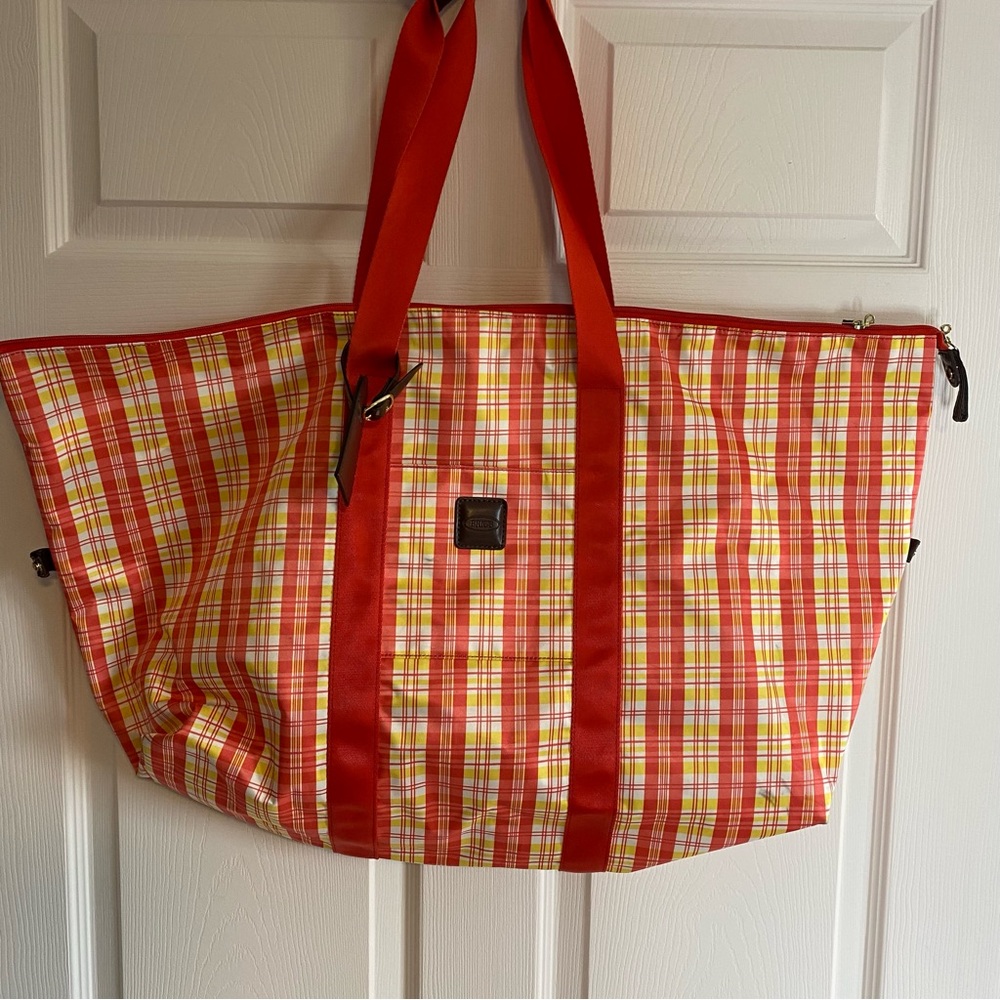 Bric's Vibrant Plaid Travel Bag with Red Straps